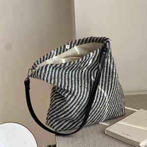 Close-up of wool tote bag interior with magnetic clasp and thick fabric texture