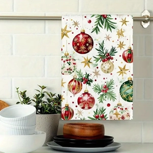 Detail of Christmas microfiber kitchen towel featuring festive ornaments hanging on a rack