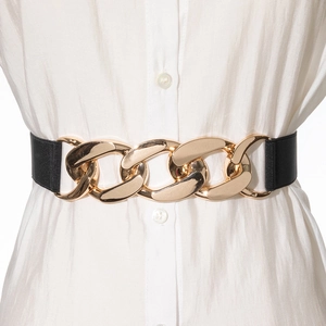 Detail of black elastic waist belt with large interlocking gold metal chain buckle