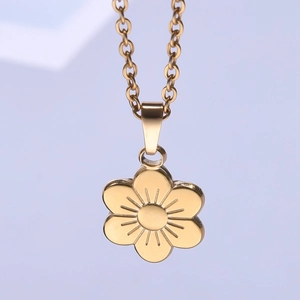 Macro shot of 18k gold plated stainless steel six-petal flower pendant on O-chain