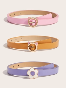 Detailed view of pink, orange, and purple children's belts with golden cat-shaped buckles