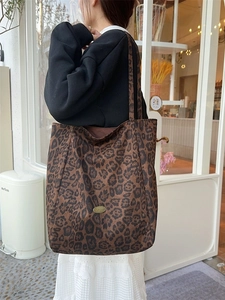 Brown leopard print large tote bag with gold metal logo plaque for fashion commute