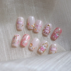Pink and white Christmas press-on nails with 3D bears, deer and snowflakes patterns
