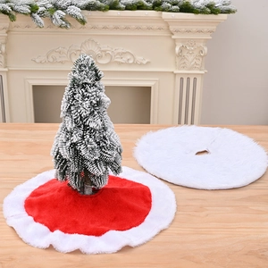 Detailed view of red plush Christmas tree skirt with white border and mini frosted tree