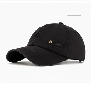 Close-up of the Mowrid embroidery and metal ventilation eyelet on a black cotton cap
