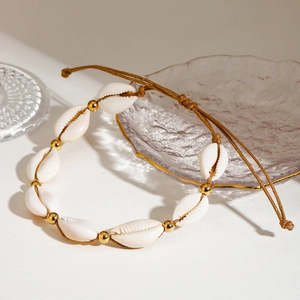 Bohemian adjustable beach anklet with natural white cowrie shells and gold beads