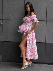 Detail view of floral off-shoulder dress with puff sleeves and sexy side leg slit