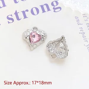 Detailed macro view of heart-shaped alloy charms with pink stones, size 17x18mm