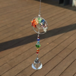 Macro shot of Rainbow Tree of Life crystal suncatcher with a clear faceted pendant