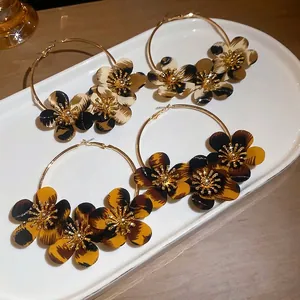 Vintage leopard print fabric flower hoop earrings with golden metal finish for women
