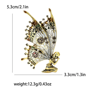 Golden enamel butterfly fairy brooch with hollow wings measuring 5.3cm x 3.3cm