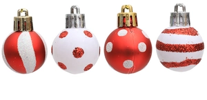 Detail of red and white Christmas baubles with glitter stripes and polka dot patterns