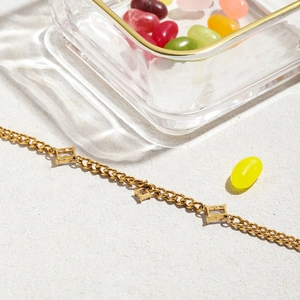 Detail of 18K gold stainless steel chain bracelet with rectangular zircon settings