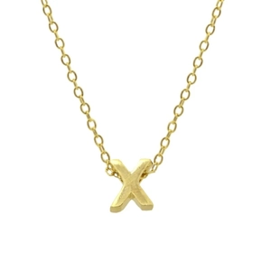Macro detail of 925 sterling silver golden letter X pendant and refined link chain
