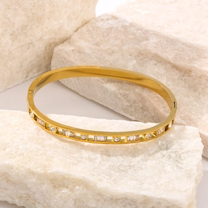 Elegant 18K gold plated titanium steel bangle with square and round cubic zirconia stones