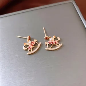 Vintage 18K gold plated rocking horse stud earrings with red enamel and white crystals