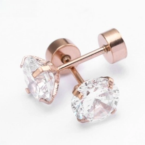 Macro view of rose gold stud earrings featuring large round cubic zirconia in four-prong setting