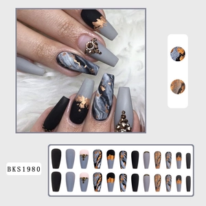 Detailed set of 24 black marble press-on nails with gold foil and rhinestone accents