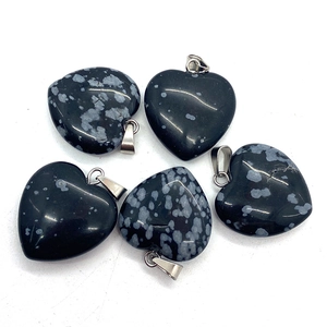 Five heart-shaped snowflake obsidian stone pendants with silver clasps on white background