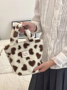Winter plush tote bag with brown heart patterns and soft faux fur texture