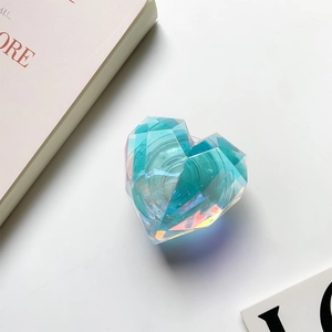 Macro shot of a laser heart-shaped crystal phone grip with vibrant iridescent facets