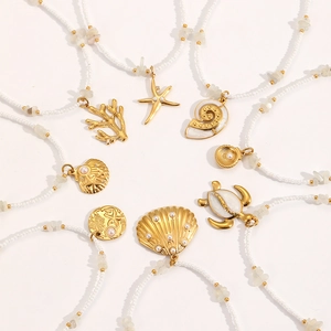 Marine series necklace featuring sea turtle and shell pendants with white bead chain