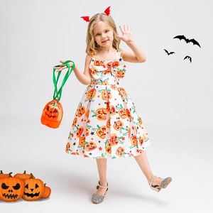 Detail of girls Halloween pumpkin print dress with a large bow and matching handbag