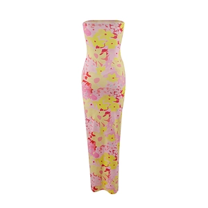 Detailed view of pink tube dress featuring vibrant yellow and red floral patterns