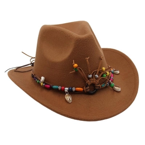 Detailed view of brown ethnic western cowboy hat with colorful beaded band and shells