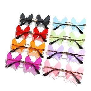 Fashionable rimless butterfly sunglasses in various vibrant colors with Y2K metal temples