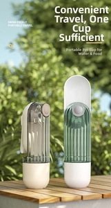 Close-up of portable pet water bottle in green and grey colors on a wooden table
