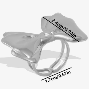 Detail view of silver bow ring with size annotations for band diameter and bow width