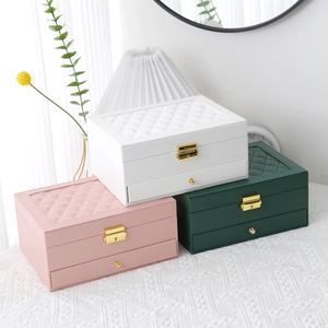 Two-tier leather jewelry box with drawers and lock in white, pink, and dark green colors