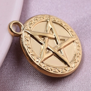 Golden 304 stainless steel pentagram star pendant with geometric patterns on purple silk