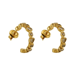 Close-up of gold U-shaped earrings with clear zircon stones on a white background