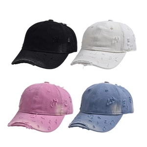 Distressed vintage denim baseball caps in black, white, pink, and blue color options