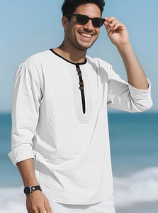 Detail of white cotton linen Henley shirt with black piping and wood-style buttons