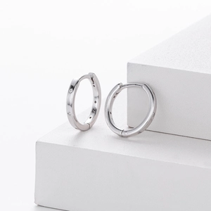 Macro shot of S925 sterling silver hoop earrings with delicate cubic zirconia stones