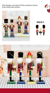 Detail of four handcrafted wooden nutcracker soldiers in plaid coats on a checkered base