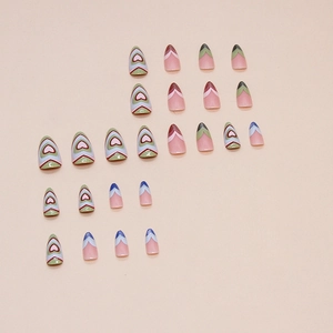 Almond shaped press-on nails set with heart textures and V-shaped French design in 24 pieces