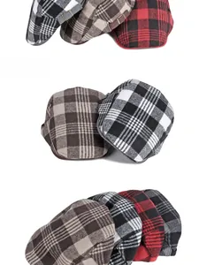 Detailed stack of plaid newsboy caps in red, black, and brown wool textures