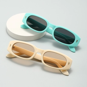 Retro square sunglasses with mint green and beige frames featuring gold diamond accents