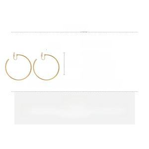 Detail of geometric gold copper hoop clip-on earrings with size and material specifications