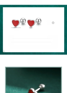 Macro view of 6mm S925 sterling silver heart earrings with red enamel and ball backs