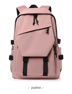 Detailed front view of pink backpack featuring black buckles and asymmetric zipper pocket