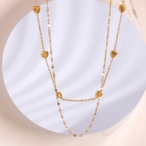 Double-layered stainless steel necklace with gold heart pendants and mixed chain links