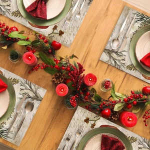 Vintage style Christmas place mat with red berries pine cones and candle decor