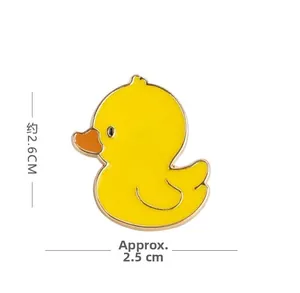 Detailed size view of a yellow cartoon duck enamel pin with golden metal outlines