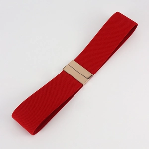 Close-up of red elastic waist belt with a golden rectangular metal interlocking buckle