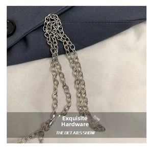 Detail shot of a slim silver O-chain metal strap for an elegant evening clutch bag